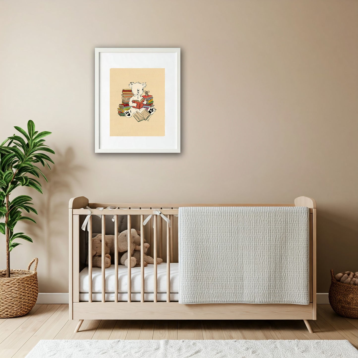Framed Pola Bear Oliver art print hanging above a modern neutral-toned crib in a cozy nursery, featuring soft textures, a teddy bear, and a natural plant.