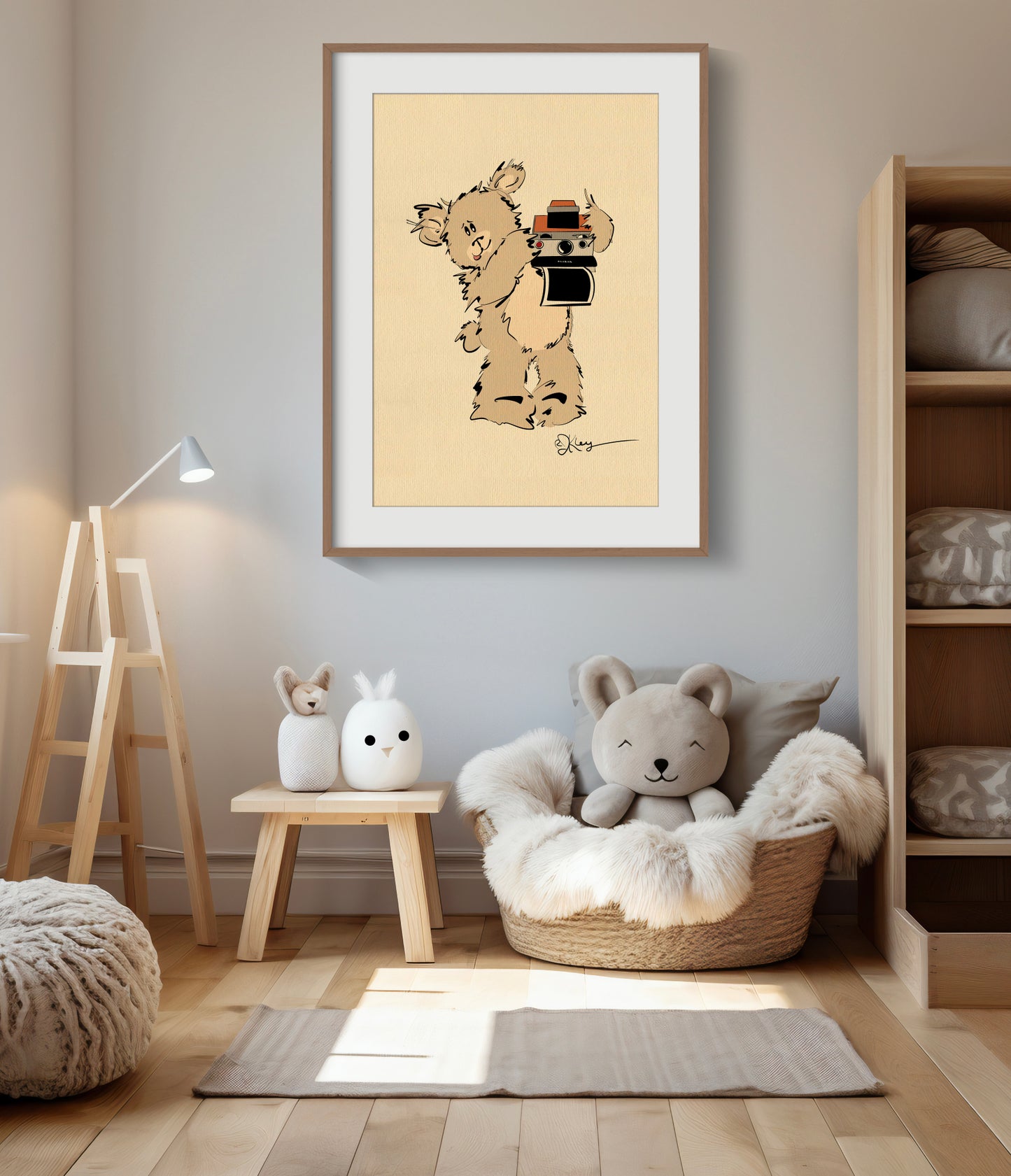 A Pola Bear "Greg" print, displayed in a large wood frame, hangs in a warm and modern nursery. The print is styled above a cozy basket chair and minimalist wooden toys, creating a stylish and inviting space.