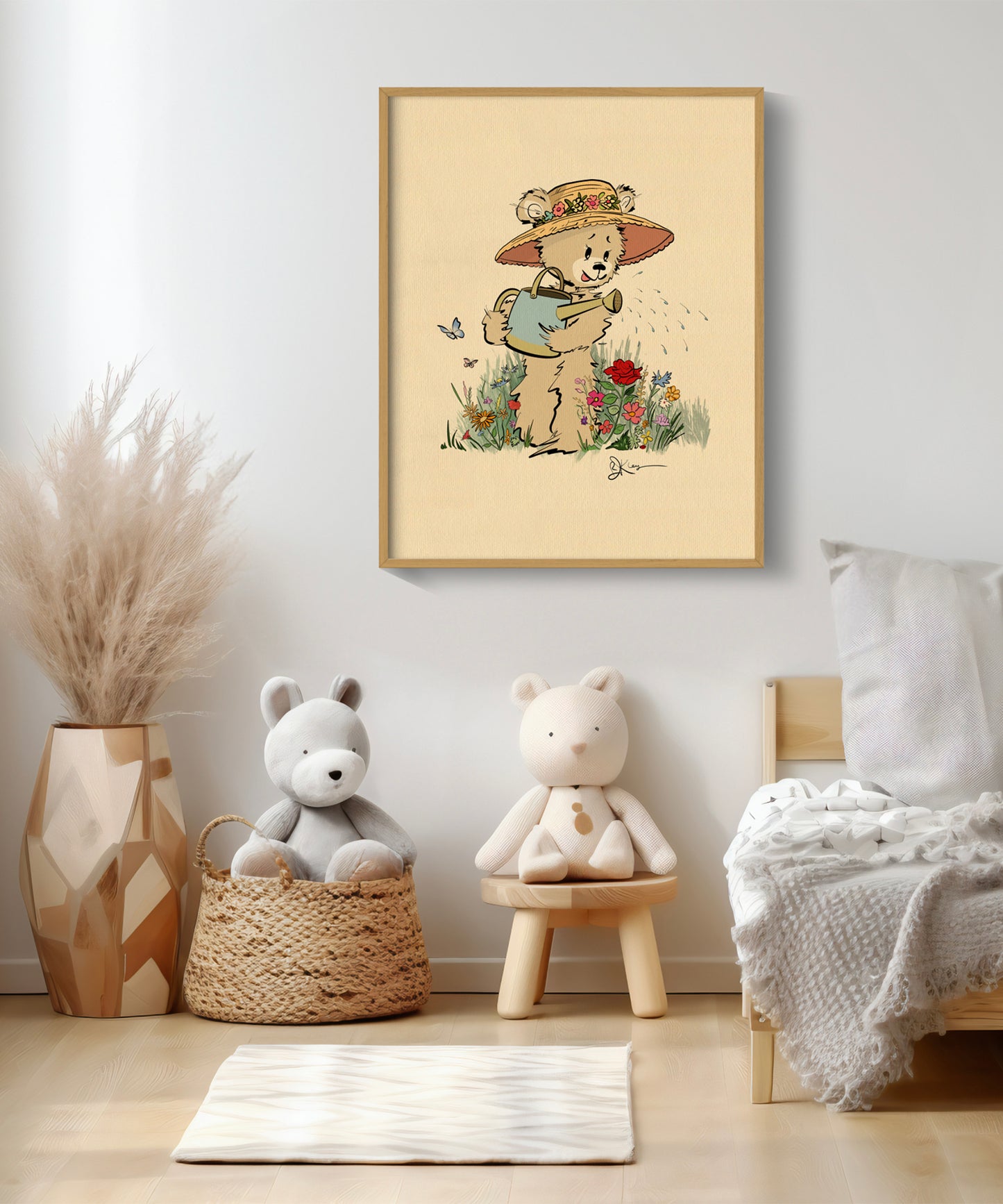 Framed 'Joanie' the Gardener Pola Bear art print, featuring a Pola Bear watering flowers, displayed on a white wall in a cozy nursery or child's room with stuffed animals and natural decor.