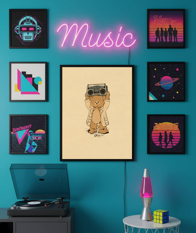 A framed art print of Lloyd the Boombox Pola Bear, holding a boombox over his head, hanging on a teal wall in an 80s-themed music room with other retro-styled art prints, a neon 'Music' sign, a record player, and a lava lamp.