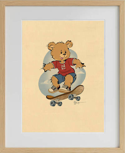 Framed vintage-style wall art featuring Radley the skateboarding Pola Bear. The retro, hand-drawn character illustration is displayed in a natural light wood frame with a white mat, adding a classic touch to nursery or playroom decor.